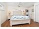 Comfortable bedroom with two side tables and a bed that is furnished with fishing decor to suit the property's beachy theme at 342 S Gulf Blvd, Placida, FL 33946