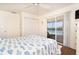 Well-lit bedroom featuring balcony access with stunning waterfront views, providing a serene escape and connection to the outdoors at 342 S Gulf Blvd, Placida, FL 33946