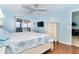 Bright bedroom featuring a balcony view, modern TV, and coastal-themed decor, creating a relaxing retreat at 342 S Gulf Blvd, Placida, FL 33946