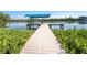 Dock and boat lift overlooking the water and lush surroundings at 342 S Gulf Blvd, Placida, FL 33946