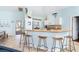 Bright kitchen featuring a breakfast bar with seating and modern appliances at 342 S Gulf Blvd, Placida, FL 33946