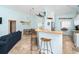 Open kitchen with bar seating, stainless steel appliances, and beachy decor at 342 S Gulf Blvd, Placida, FL 33946
