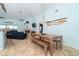 Open-concept living space with coastal decor, dining area, fireplace, and bar seating at 342 S Gulf Blvd, Placida, FL 33946