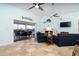 Spacious living room overlooking the water with comfortable seating, a fireplace, and sliding doors to a lanai at 342 S Gulf Blvd, Placida, FL 33946