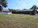 Large backyard area with screened-in porch and white picket fence at 351 Bobby Jones Rd # 351, Sarasota, FL 34232