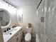 Bright bathroom featuring a vanity with modern fixtures and a tiled shower with glass door at 351 Bobby Jones Rd # 351, Sarasota, FL 34232
