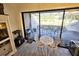 Breakfast nook with a view of the screened in porch and the golf course at 351 Bobby Jones Rd # 351, Sarasota, FL 34232
