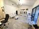 Bright living room with tile floor, chandelier and view of screened-in patio at 351 Bobby Jones Rd # 351, Sarasota, FL 34232