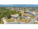 Aerial view of homes with mature landscaping, community pool and well maintained lawn at 3586 Cape Haze N Dr # B6, Rotonda West, FL 33947