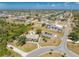 Expansive aerial view of residential neighborhood with community pool and serene landscaping at 3586 Cape Haze N Dr # B6, Rotonda West, FL 33947
