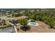 Condos with mature trees, parking, a community pool, and lush surrounding vegetation at 3586 Cape Haze N Dr # B6, Rotonda West, FL 33947