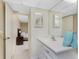 Bright bathroom with a vanity and a mirror with the bedroom showing through the door at 3586 Cape Haze N Dr # B6, Rotonda West, FL 33947