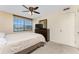 Bedroom featuring a king bed, dark wood furniture, and a window with a view at 3586 Cape Haze N Dr # B6, Rotonda West, FL 33947