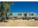 Inviting two-story condo with a vibrant green roof and lush landscaping with a private balcony for outdoor enjoyment at 3586 Cape Haze N Dr # B6, Rotonda West, FL 33947