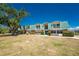 Charming condos with a turquoise roof, lush landscaping, and well-maintained lawn at 3586 Cape Haze N Dr # B6, Rotonda West, FL 33947