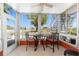 Enclosed lanai features tile floor, comfortable seating, and ample sunlight exposure at 3586 Cape Haze N Dr # B6, Rotonda West, FL 33947
