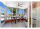 Bright lanai featuring tile flooring, ceiling fan, and views of the lush outdoor landscape at 3586 Cape Haze N Dr # B6, Rotonda West, FL 33947