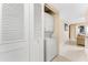 Hall laundry closet with stacked washer/dryer and louvered doors for concealed convenience at 3586 Cape Haze N Dr # B6, Rotonda West, FL 33947