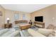 Comfortable living room with tile floors, neutral walls, stylish furnishings and a view to the dining area at 3586 Cape Haze N Dr # B6, Rotonda West, FL 33947