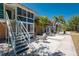 Relaxing patio with tables and chairs for outdoor dining with views of tropical landscaping at 3586 Cape Haze N Dr # B6, Rotonda West, FL 33947
