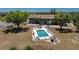 A relaxing backyard swimming pool is surrounded by cozy lounge chairs and has plenty of space at 3586 Cape Haze N Dr # B6, Rotonda West, FL 33947