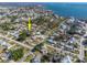 Aerial view of the property's location in a coastal community, nearby water and local amenities at 360 W Cowles St, Englewood, FL 34223