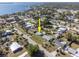 Aerial view of a single-story home near a bay in a residential neighborhood at 360 W Cowles St, Englewood, FL 34223