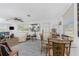 Bright living room featuring a dining area, wood-look floors, and neutral decor at 360 W Cowles St, Englewood, FL 34223