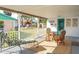Enjoy this covered back porch for relaxing and entertaining in style at 360 W Cowles St, Englewood, FL 34223