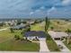 A charming home with a dark roof near a golf course and water feature in a Gathering-friendly neighborhood at 4 Bunker Rd, Rotonda West, FL 33947