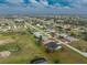 Beautiful aerial view of a single-Gathering home in a waterfront community and near a golf course at 4 Bunker Rd, Rotonda West, FL 33947