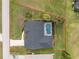 An overhead shot shows a well-maintained home and pool, surrounded by a large yard at 4 Bunker Rd, Rotonda West, FL 33947