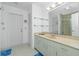 Bathroom with a white vanity, large mirror, and shower/tub combination at 4 Bunker Rd, Rotonda West, FL 33947