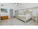 Spacious bedroom with decorative rug, light wood flooring, and stylish furnishings at 4 Bunker Rd, Rotonda West, FL 33947