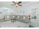 Spacious living room with a large sectional sofa and view of the bedroom at 4 Bunker Rd, Rotonda West, FL 33947