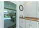 Outdoor kitchen with sink next to sliding doors and access to the pool area at 4 Bunker Rd, Rotonda West, FL 33947