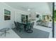 Covered patio with ample seating and dining area, ideal for entertaining with views of the garden at 4 Bunker Rd, Rotonda West, FL 33947