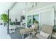 Cozy patio with lounge chairs, ceiling fan, and view of the pool at 4 Bunker Rd, Rotonda West, FL 33947