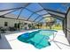 Inviting screened pool with a view of the backyard and plenty of sunshine at 4 Bunker Rd, Rotonda West, FL 33947