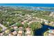 High-altitude view showcases home nestled within a community with lakes and ocean views at 425 Laurel W Rd, Nokomis, FL 34275