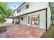 Back of house with brick patio and french doors leading inside at 425 Laurel W Rd, Nokomis, FL 34275