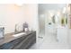 Bathroom featuring a marble countertop, coffee machine and access to the shower and toilet at 425 Laurel W Rd, Nokomis, FL 34275