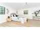 Bedroom featuring natural light, a stylish bed with decorative pillows, and modern decor at 425 Laurel W Rd, Nokomis, FL 34275