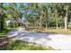 The home is situated on a large lot with a long driveway made of crushed shells at 425 Laurel W Rd, Nokomis, FL 34275