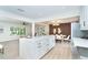 Open-concept kitchen featuring a large island, modern appliances, and seamless access to living spaces at 425 Laurel W Rd, Nokomis, FL 34275