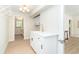 Convenient laundry room with white cabinetry, a quartz countertop, and a gold faucet at 425 Laurel W Rd, Nokomis, FL 34275