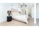 The main bedroom boasts stylish lighting, neutral tones and bright light from the open layout at 425 Laurel W Rd, Nokomis, FL 34275