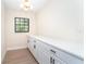 Office space with a long countertop, modern lighting, and a window for natural light at 425 Laurel W Rd, Nokomis, FL 34275