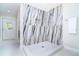 Luxurious walk-in shower featuring marble walls, modern fixtures, and a sleek design at 425 Laurel W Rd, Nokomis, FL 34275