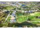 Gorgeous aerial view of a neighborhood with a golf course and pond at 5 Saint John Blvd, Englewood, FL 34223